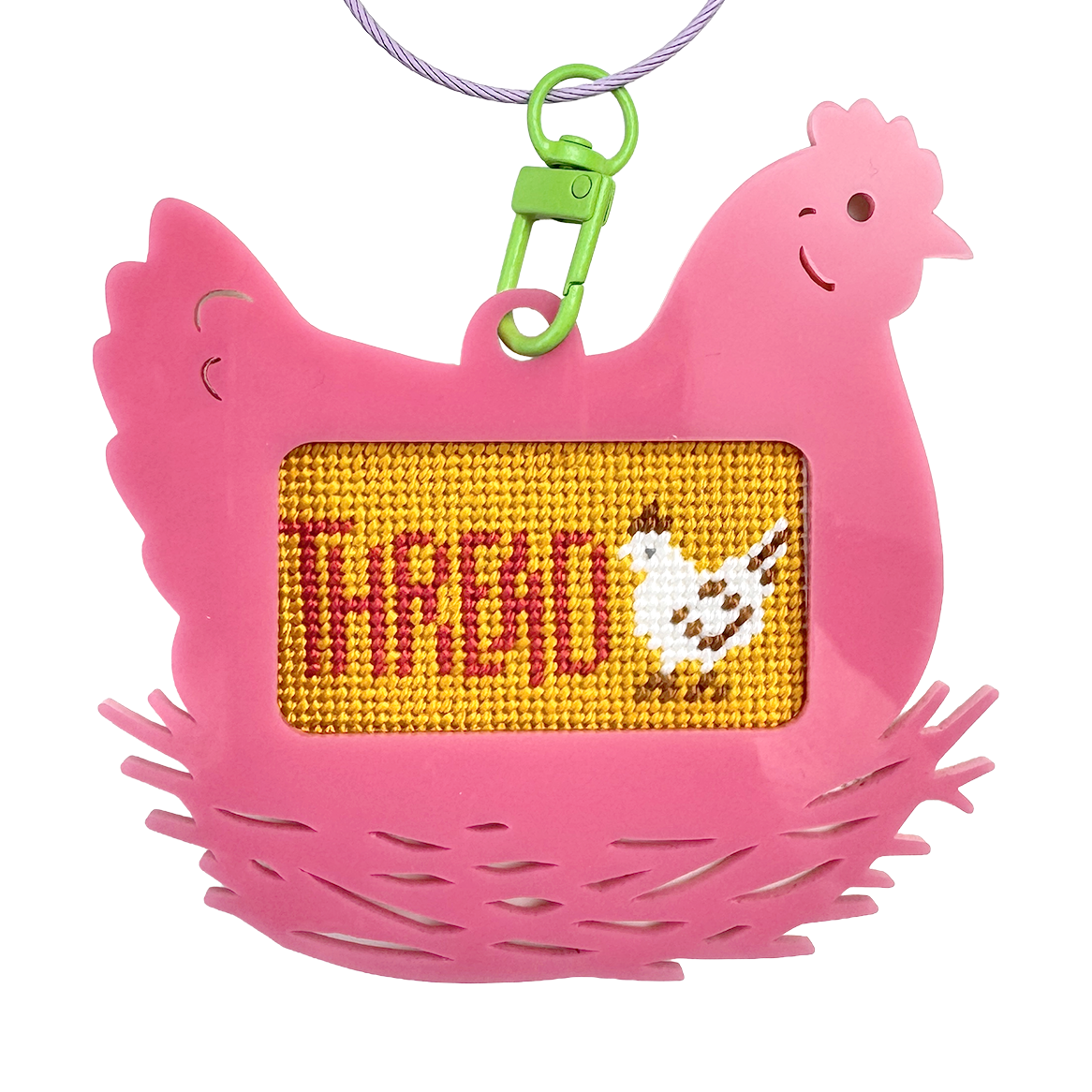 Pink chicken-shaped bag tag keychain with a yellow panel displaying text "thread" and a chicken illustration.