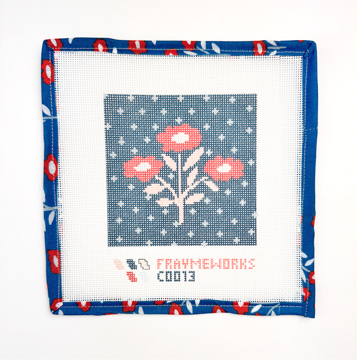 Needlepoint canvas red white and blue floral design on fabric with floral border and Handker design .