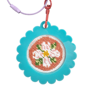 Cross-stitched bag tag keychain with floral design on a blue frame, attached to a metal clip and wire